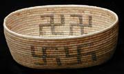 A Mission Indian basket adorned with swastikas